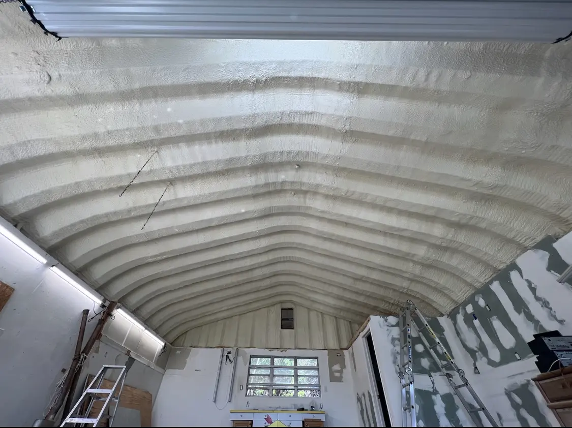 Spray polyurethane foam applied to the underside of a metal roof deck in Crystal